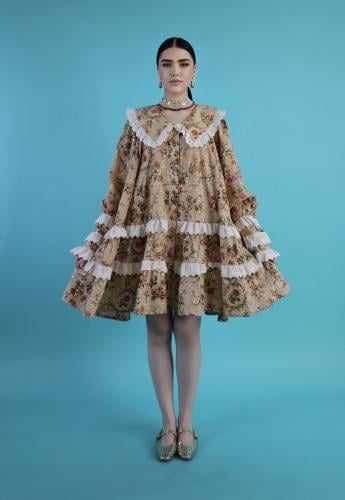A dress made of high-quality cotton fabric with a loose fit, distinctive color, and details.