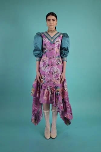 A dress with a distinctive cut and design made of high-quality cotton, equipped with puffed sleeves made of a different fabric.