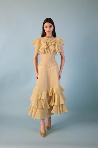 A beige-yellowish dress with a distinctive design made of georgette fabric