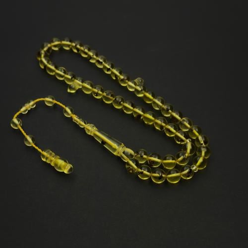A prayer bead with a clear crystal bead