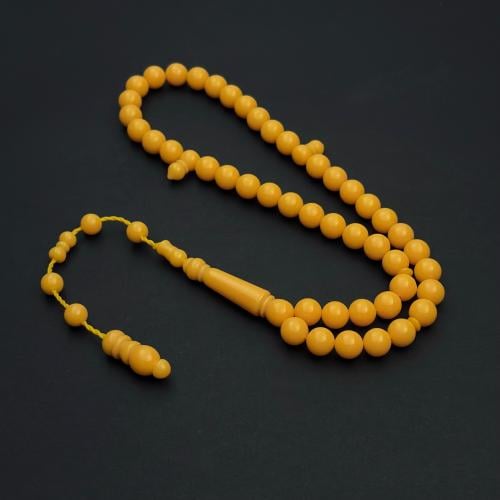 A bracelet with peach-colored beads