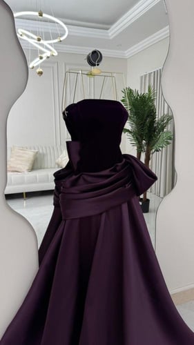 فستان سهرة بتصميم درابيه أنيق عدة الوان