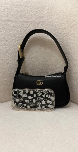 شنطة يد قوتشي