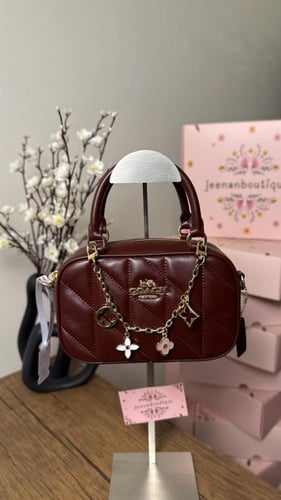 شنطة يد كوتش عنابي