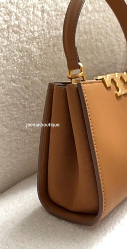 شنطة يد توري بورش ميني بني