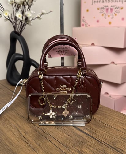 شنطة يد كوتش عنابي