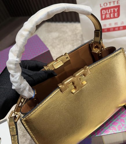 شنطة يد توري بورش ميني ذهبي