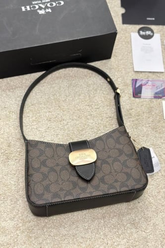 شنطة كتف كوتش بني