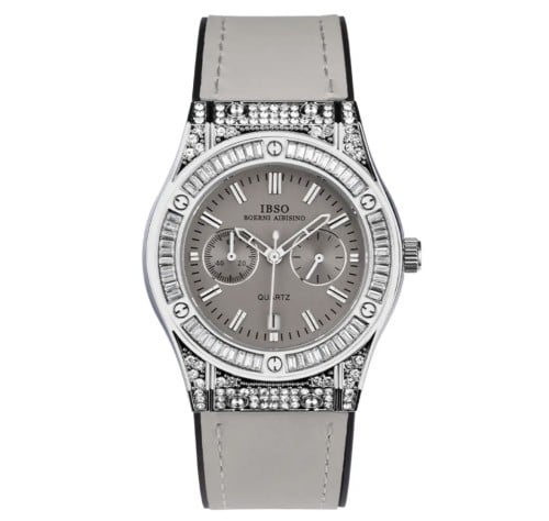 A silver watch with gray strap encrusted with crys...