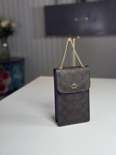 شنطة كوتش هاتف لميتد بلون بني سجنشر واسود NORTH/SO...