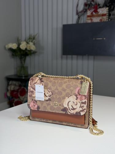 كوتش كلير بطبعة روز Klare Crossbody With roses Bag...