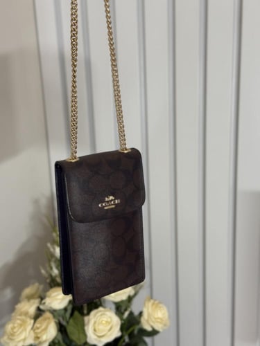 شنطة كوتش هاتف لميتد بلون بني سجنشر واسود NORTH/SO...