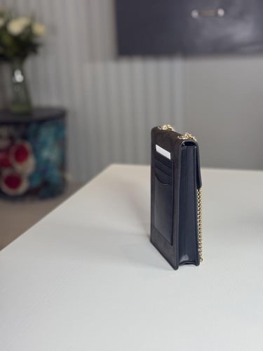 شنطة كوتش هاتف لميتد بلون بني سجنشر واسود NORTH/SO...