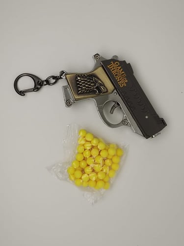 ميدالية مسدس خرز حديد