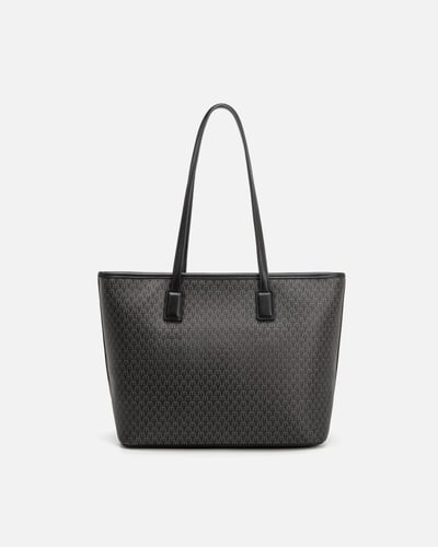 شنطة نسائيه من الجلد المنقوش الأسود