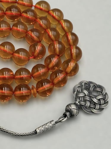 سبحة زعفرانية | زعفراني شفاف مع طرابزونة فضة