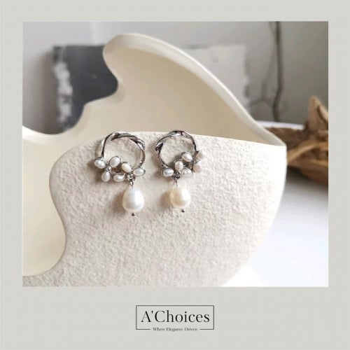 اقراط مطلية بالذهب مع اللؤلؤ الزراعي والزيركون بلو...