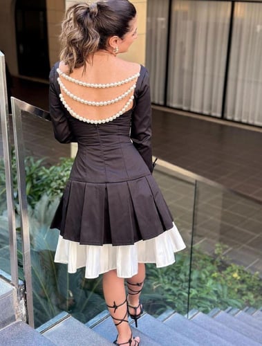 فستان سهرة أسود بكلفة بيضاء - أناقة بتفاصيل مميزة