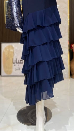 فستان طبقات بأكمام ترتر - تألقي بفخامة وإطلالة ساح...