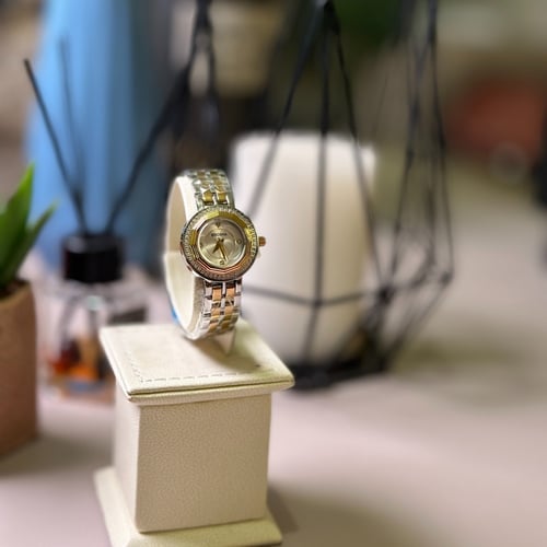 ساعة نسائية بسوار ذهبي وفضي من بروشا BR1001