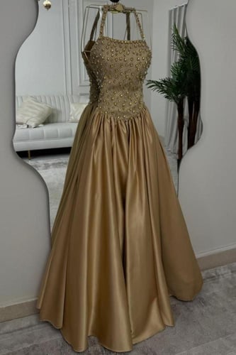 فستان سهرة مشغول لون ذهبي