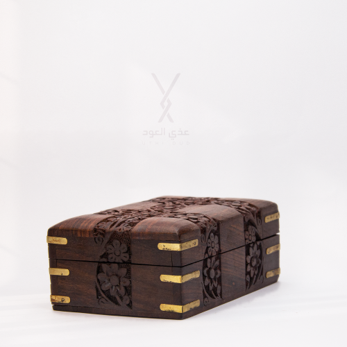 Wooden box decorated with brass