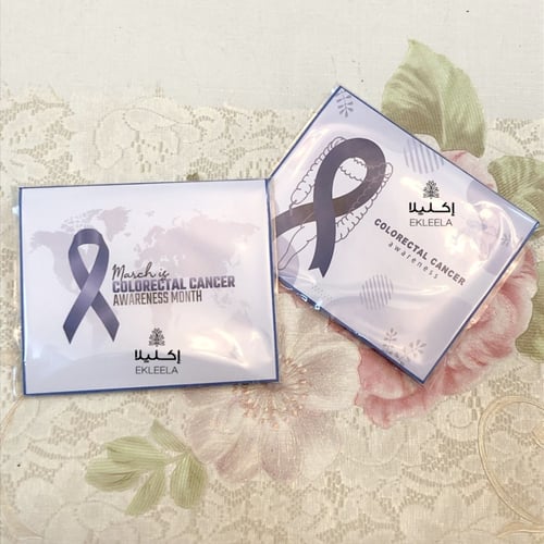 توزيعات كمامه مع ثيم توعية بسرطان القولون والمستقي...