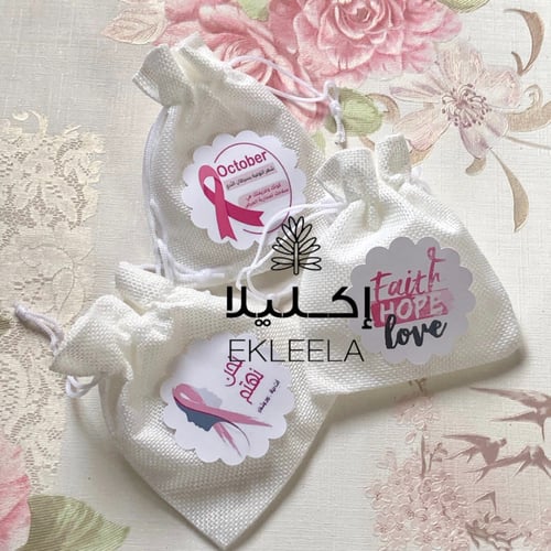 توزيعات اكياس قماشيه بثيم ورقي توعيه بسرطان الثدي...