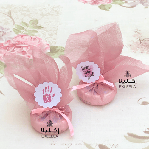 توزيعات لوشن حجم صغير بثيم توعية عن سرطان الثدي (...