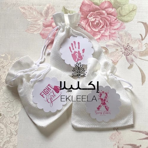 توزيعات اكياس قماشيه بثيم ورقي توعيه بسرطان الثدي...