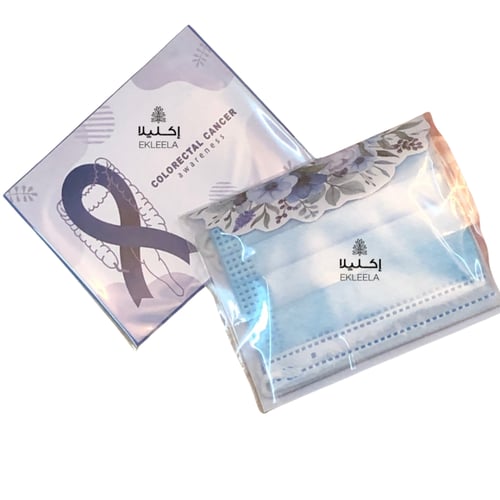 توزيعات كمامه مع ثيم توعية بسرطان القولون والمستقي...