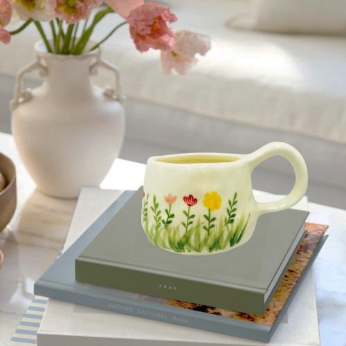 Ceramic mug with a colorful flower design