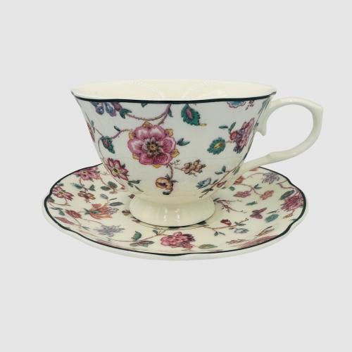 Ceramic cup with a plate with a colorful flower de...
