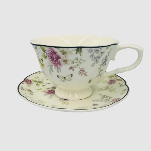 Ceramic mug with plate featuring a design of roses...