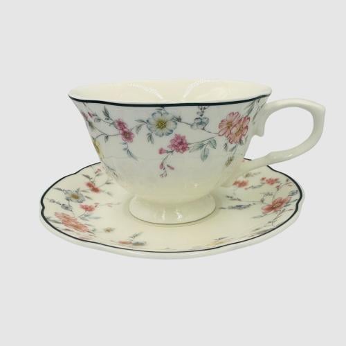 Ceramic cup with a plate with a colorful flower de...
