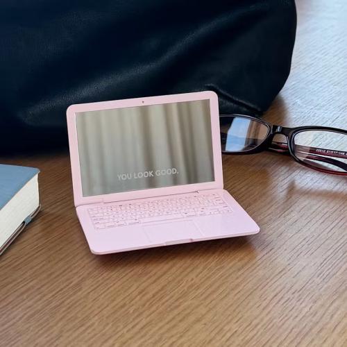 Glossier laptop mirror