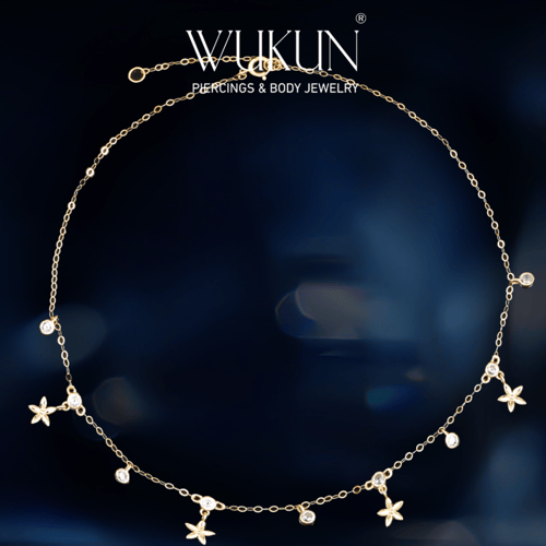 خلخال ذهب عيار 18k بأشكال ورق شجر وفصوص معلقة