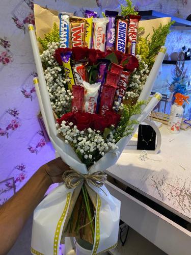 A bouquet of flowers and cookies