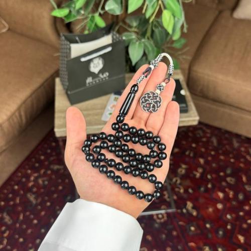 A prayer bead with a clasp