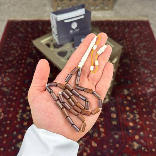 A prayer bead made of camel bone and coral