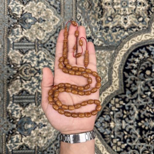 Bakalaite brown with a decorative pendant