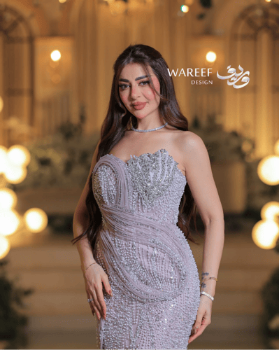 فستان سهرة مطرز بلون وردي فاتح بقصة كورسيه ا