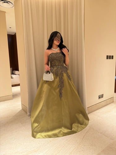 فستان سهرة زيتي فاخر بتصميم كلوش