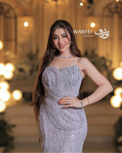 فستان سهرة مطرز بلون وردي فاتح بقصة كورسيه ا