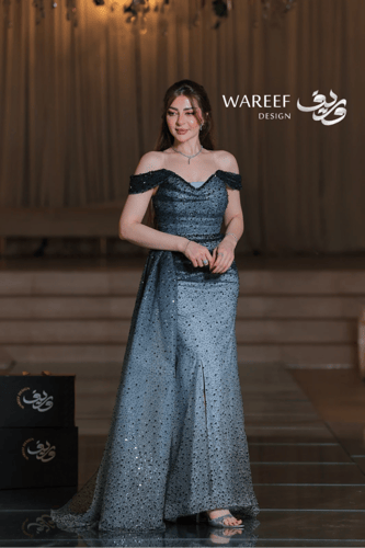 فستان سهرة أزرق سماوي طويل قما شبكي ومطرز بترتر أس...