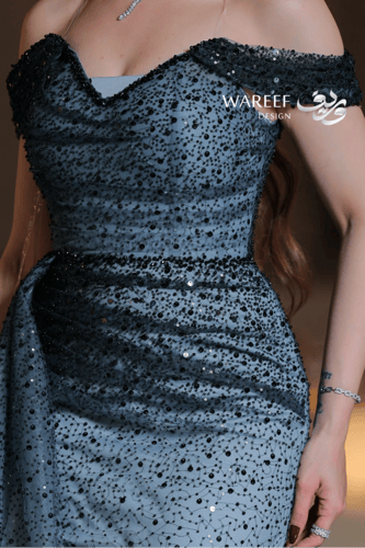 فستان سهرة أزرق سماوي طويل قما شبكي ومطرز بترتر أس...