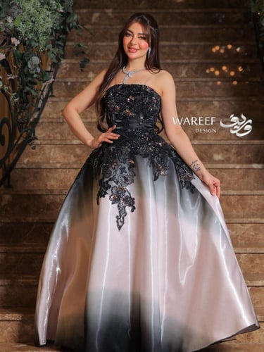 فستان سهرة بدرجات الاسود والبيج مزين بتطريز لامع