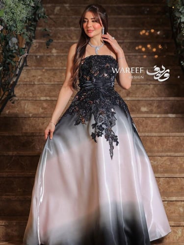 فستان سهرة بدرجات الاسود والبيج مزين بتطريز لامع