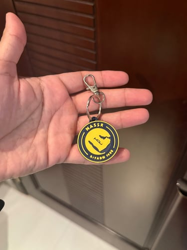ميدالية مفاتيح بشعار النصر