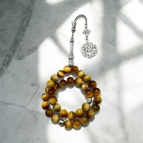 سبحه حجر عين النمر ذهبي